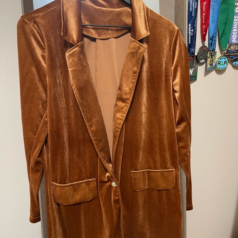 Soft and rich colored velvet blazer with button closure